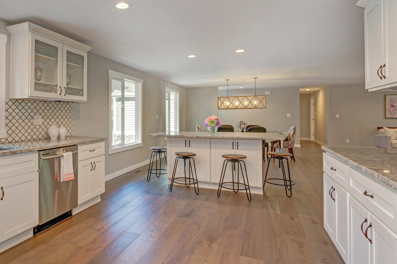 An open space kitchen with engineered hardwood floor