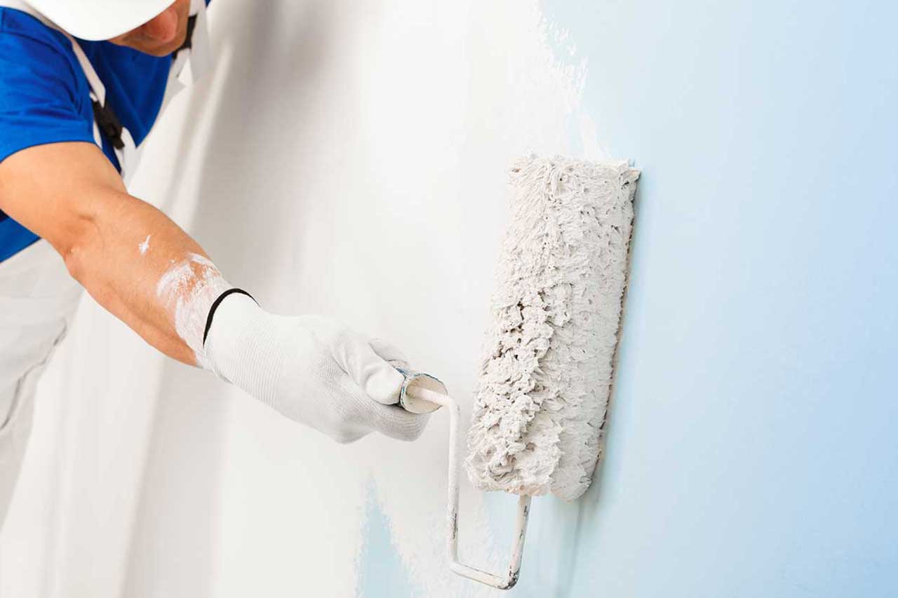 Applying whiteboard paint on wall