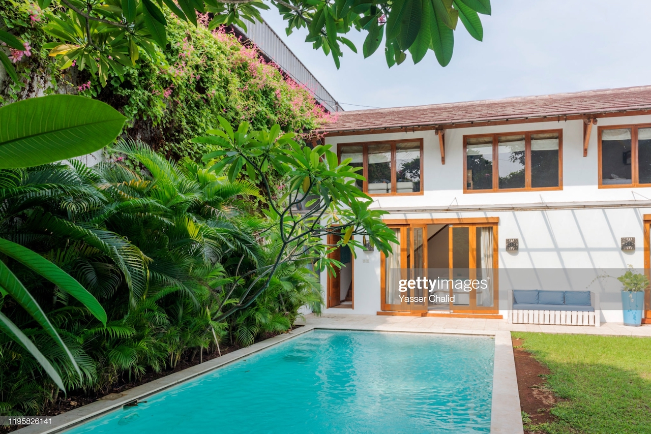 A beautiful house with a swimming pool in the backyard