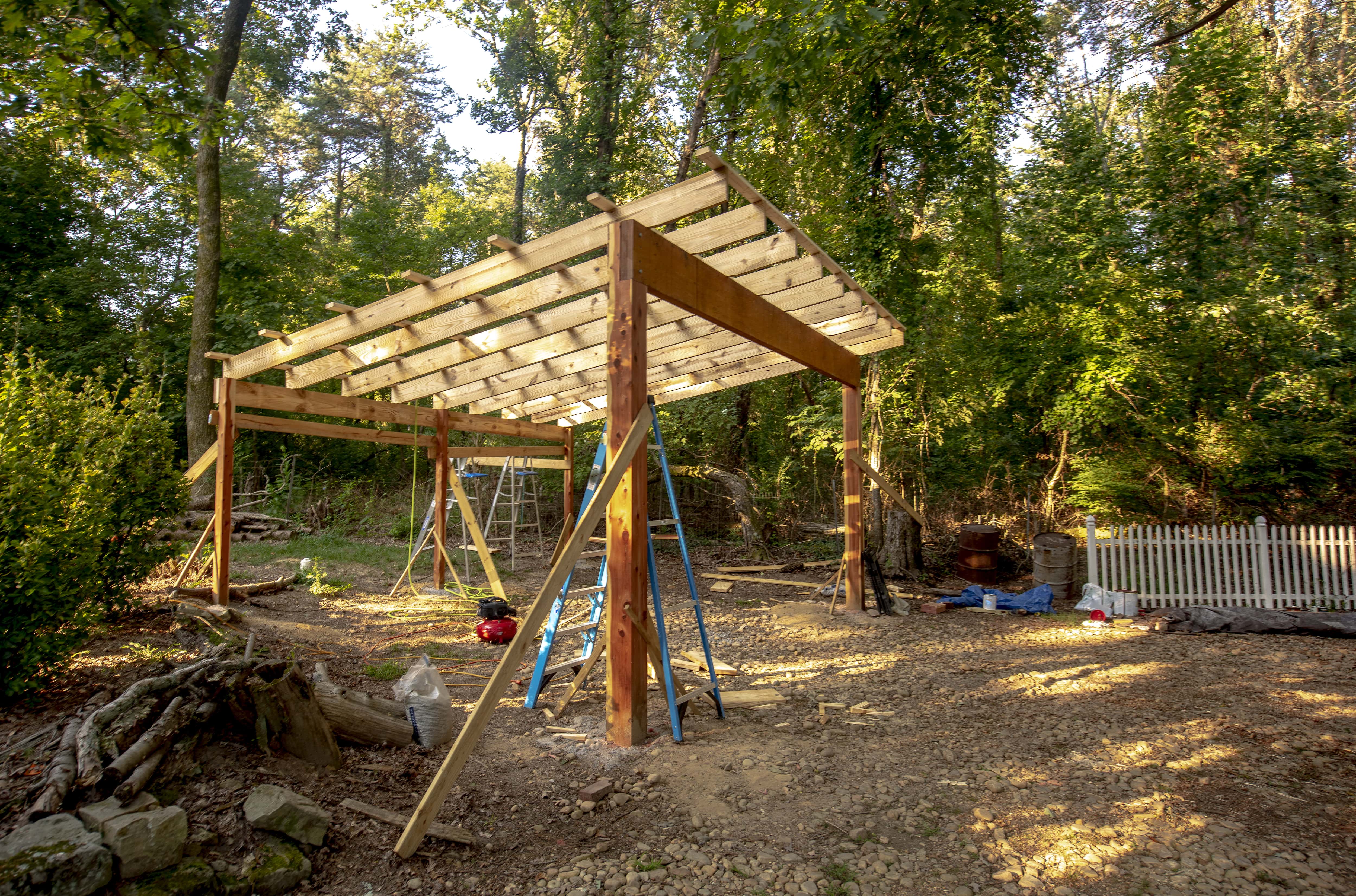Wooden carport being constructed in yard