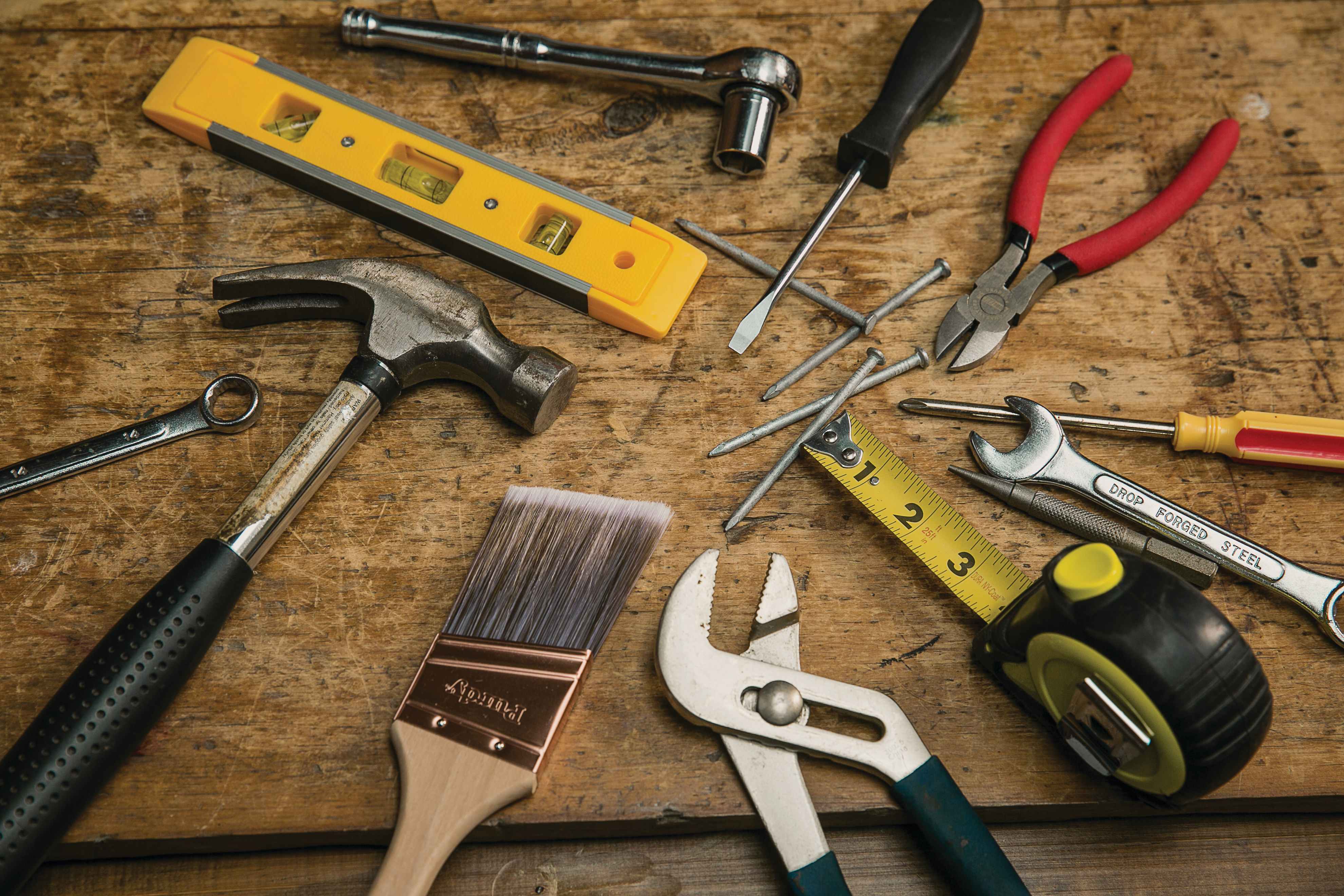 handyman tools, hammer, paint brush, pliers