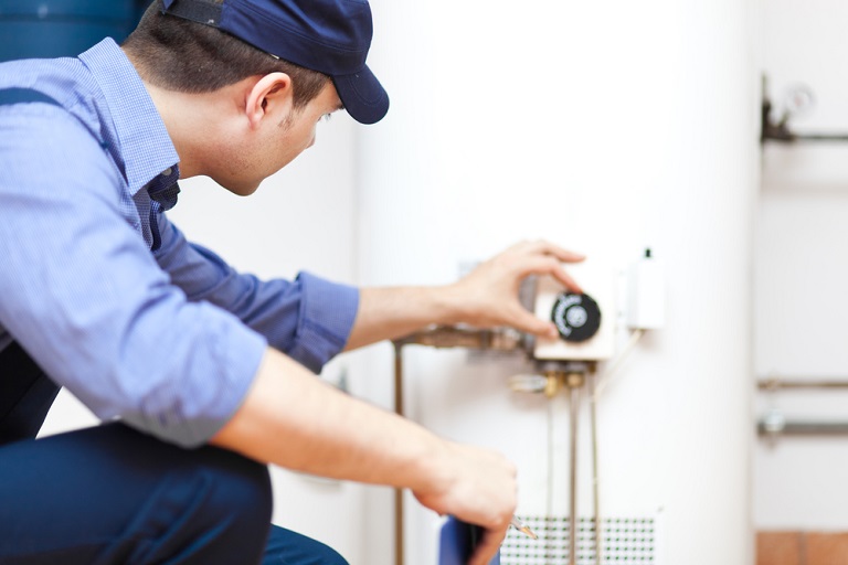 Man fixing water heater