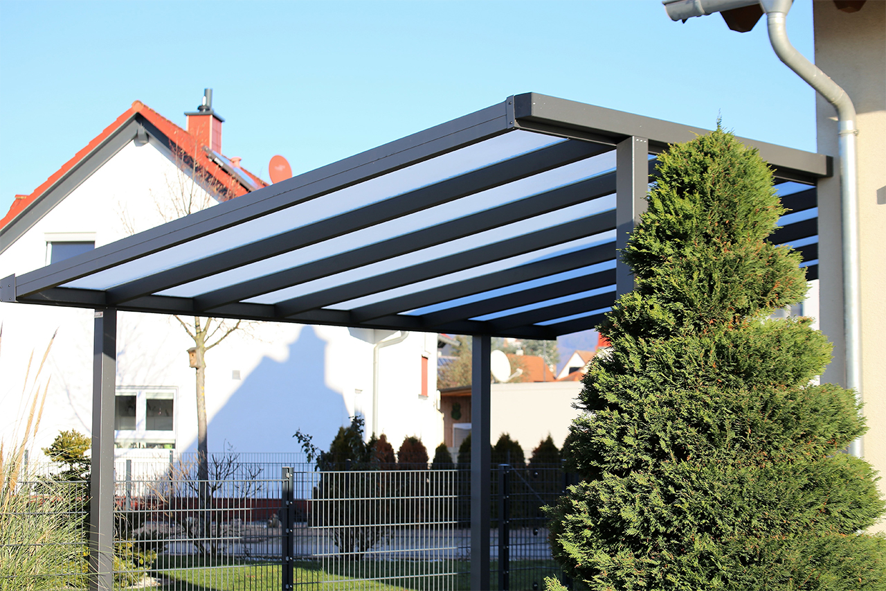 metal carport built next to a house