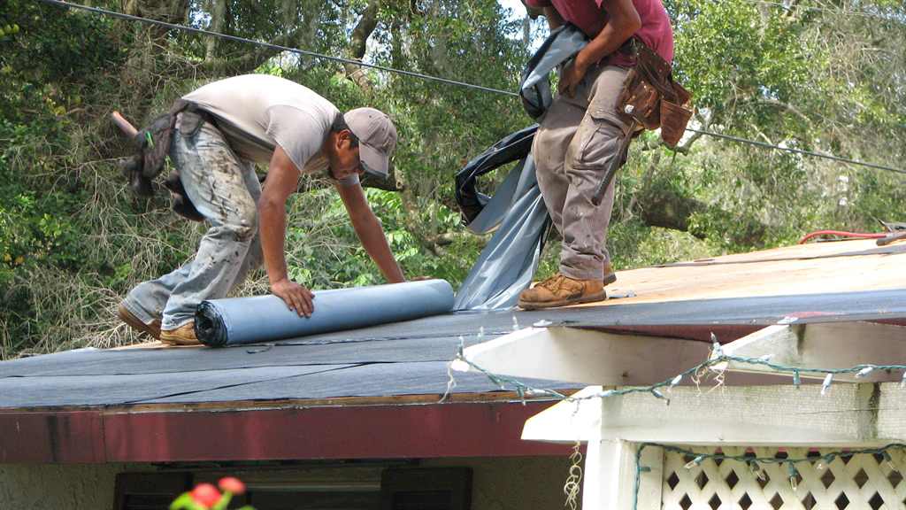 roofers installing a new roof